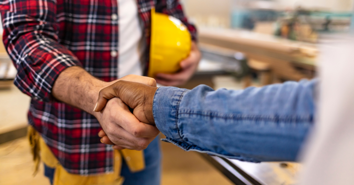 contractor shaking hands with client
