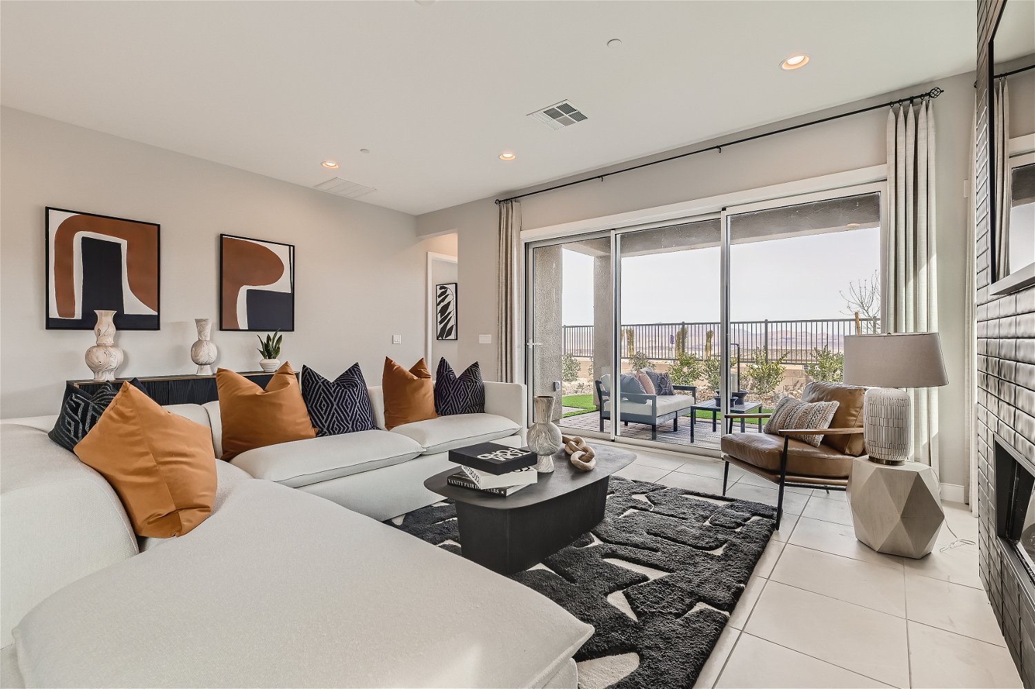 A bedroom with a large window.