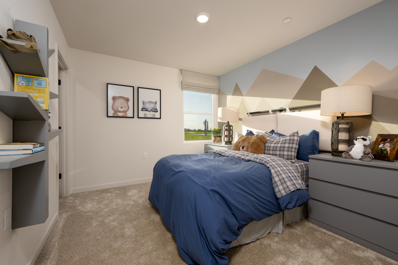 A bedroom with a bed and a lamp.