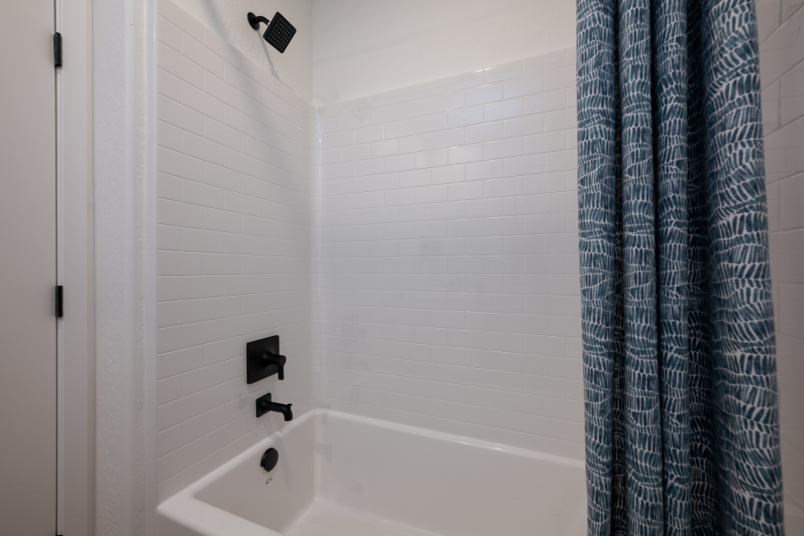 A bathtub in a bathroom.