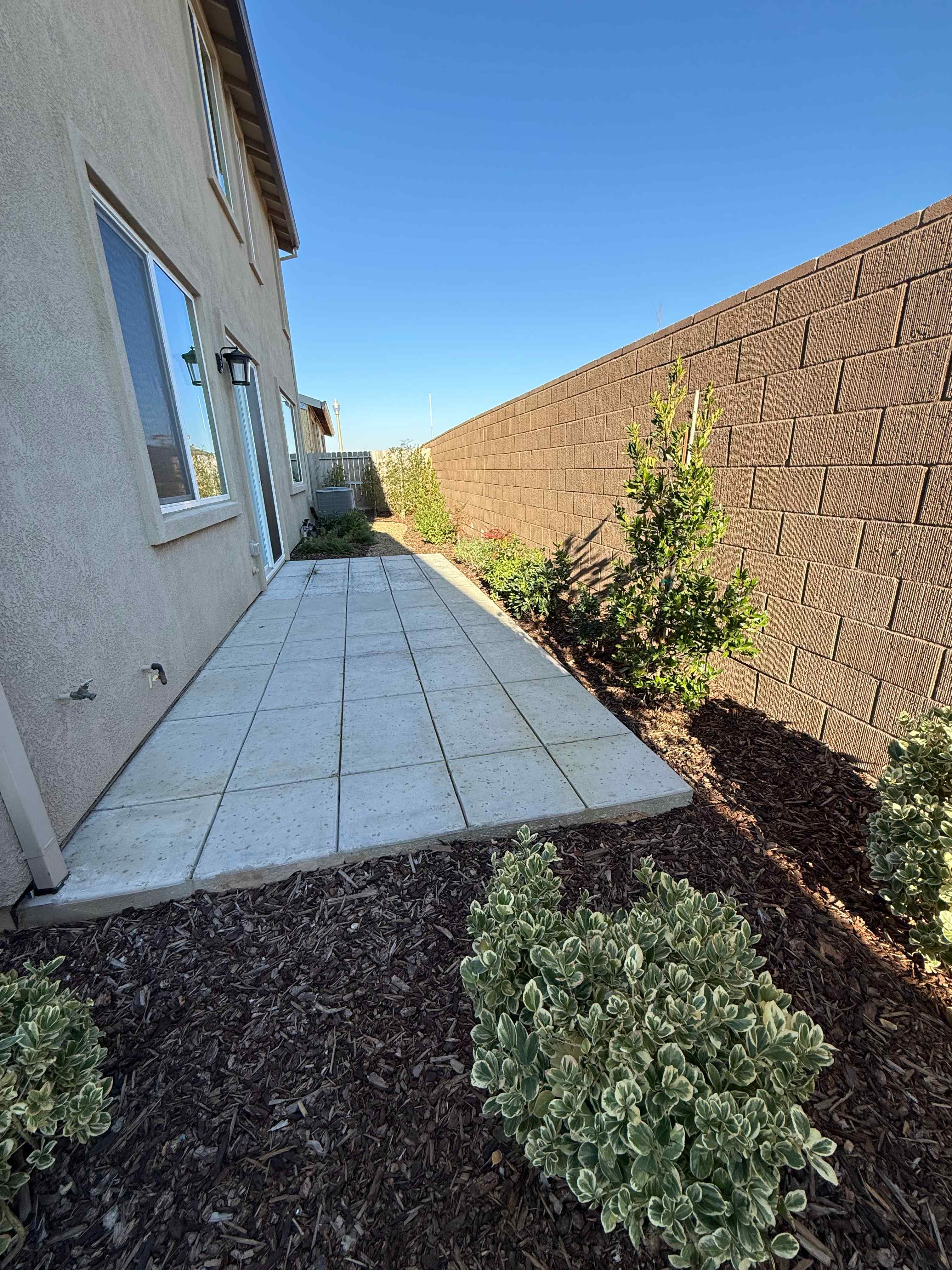 A small stone walkway between two buildings.