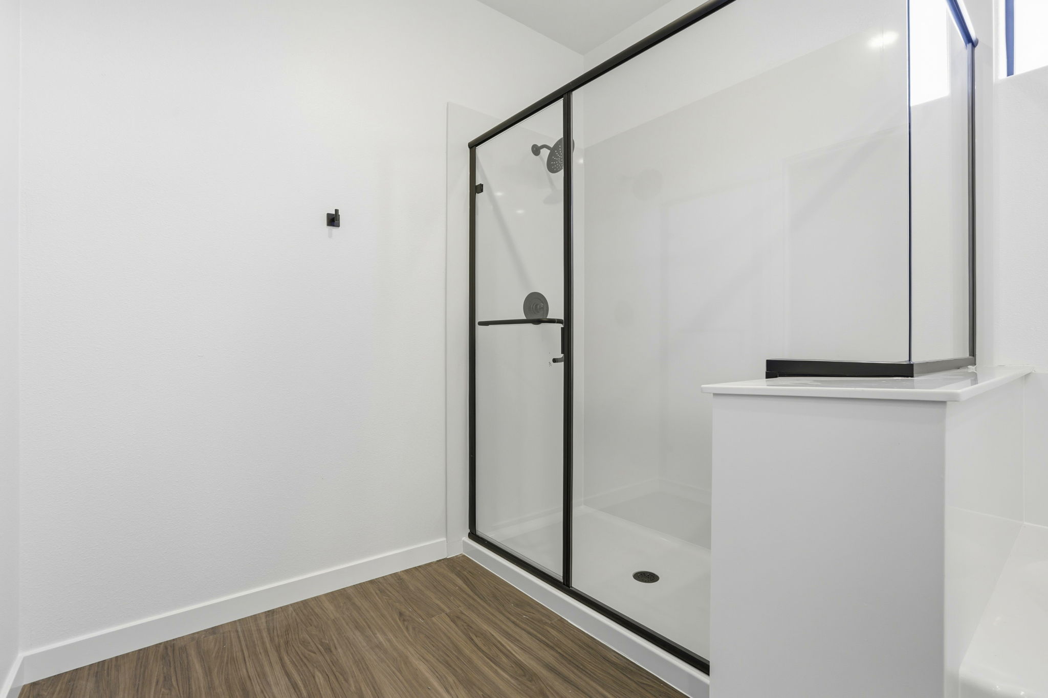 A shower unit in a bathroom.