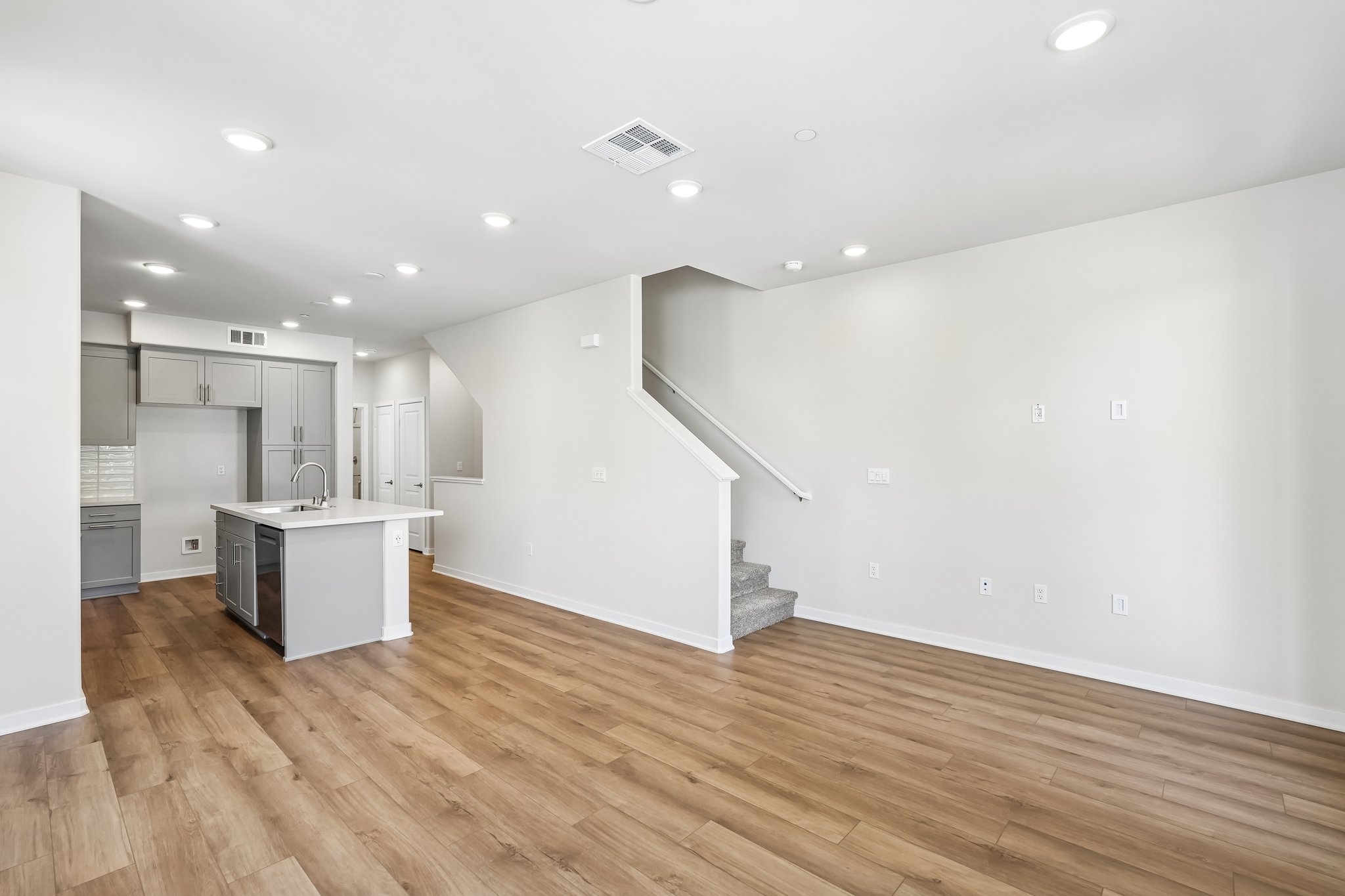 A kitchen with white walls.