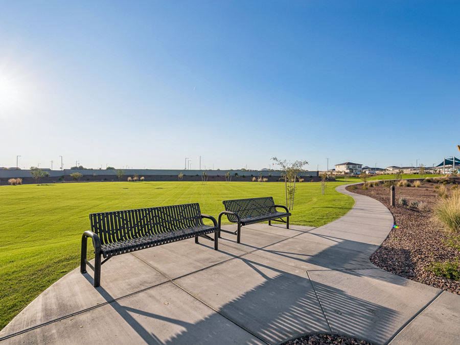 Benches on a concrete walkway.