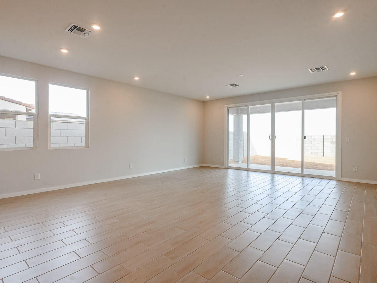 A room with a tile floor and windows.