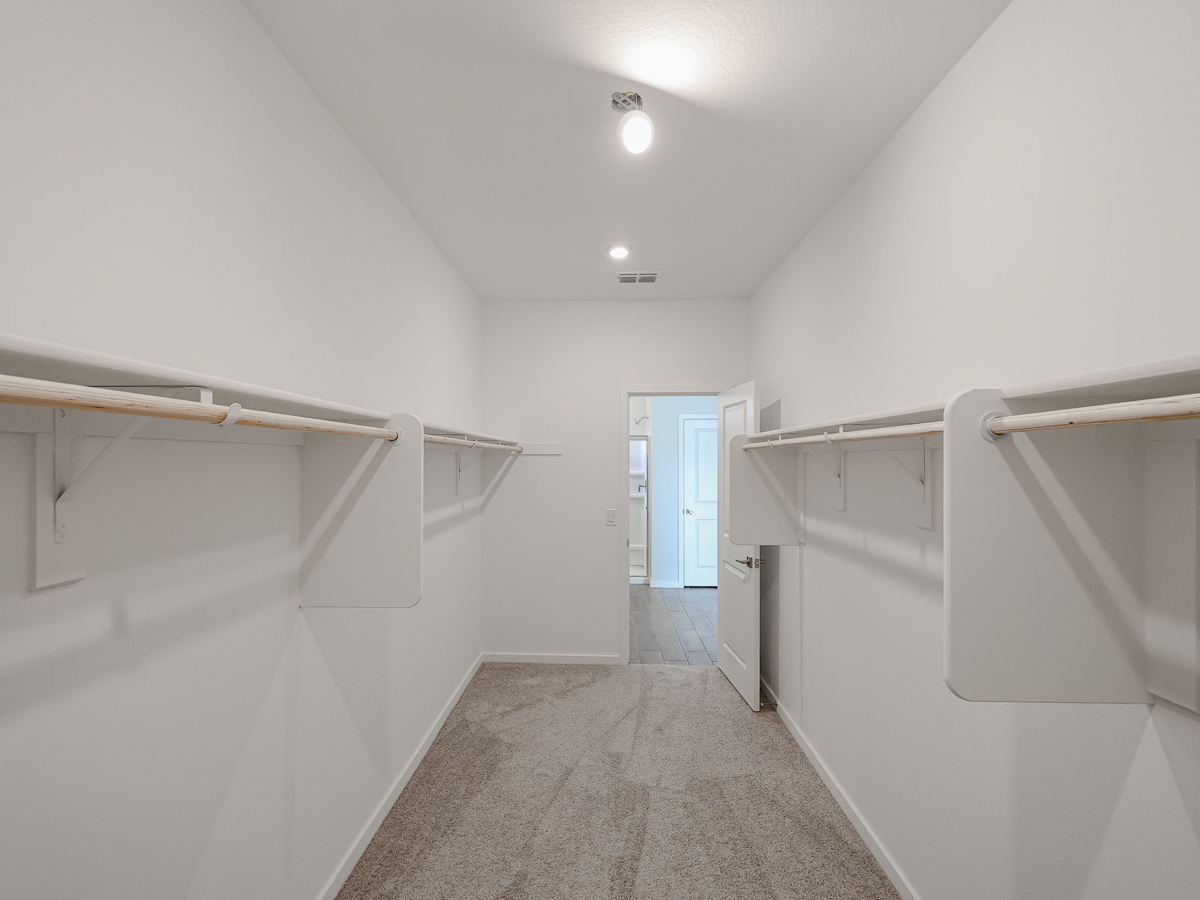 A hallway with white walls.