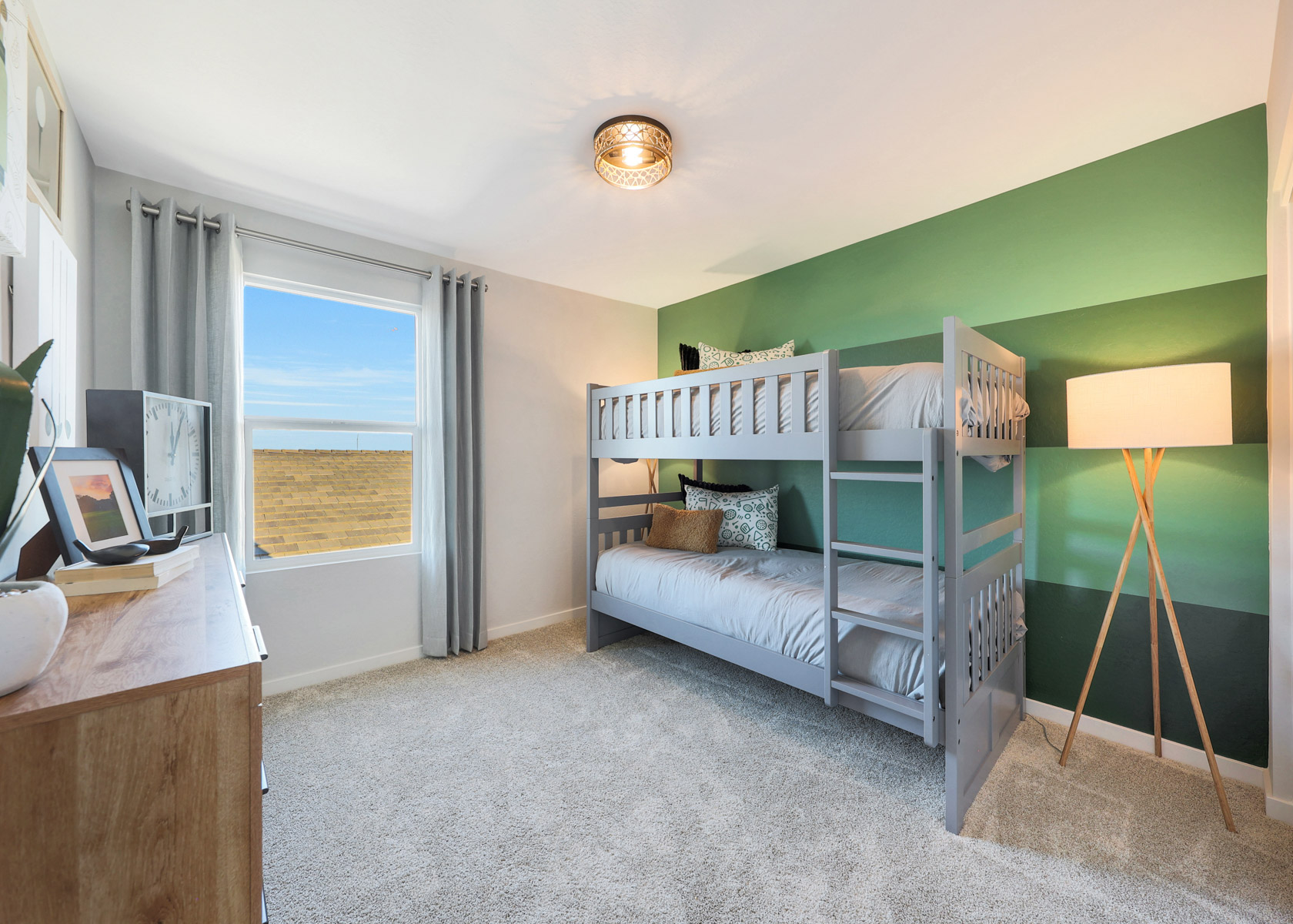 A bedroom with a bed and a desk.