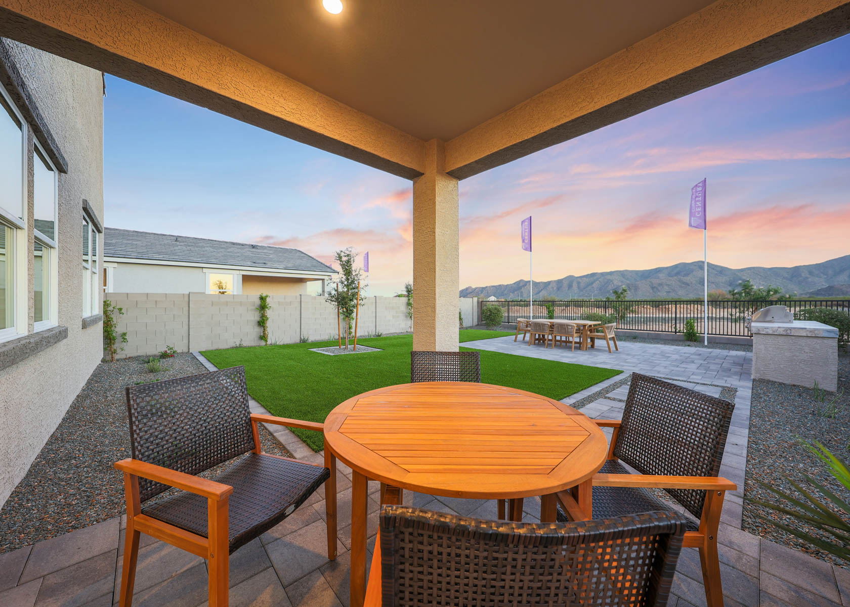 A table and chairs on a patio.