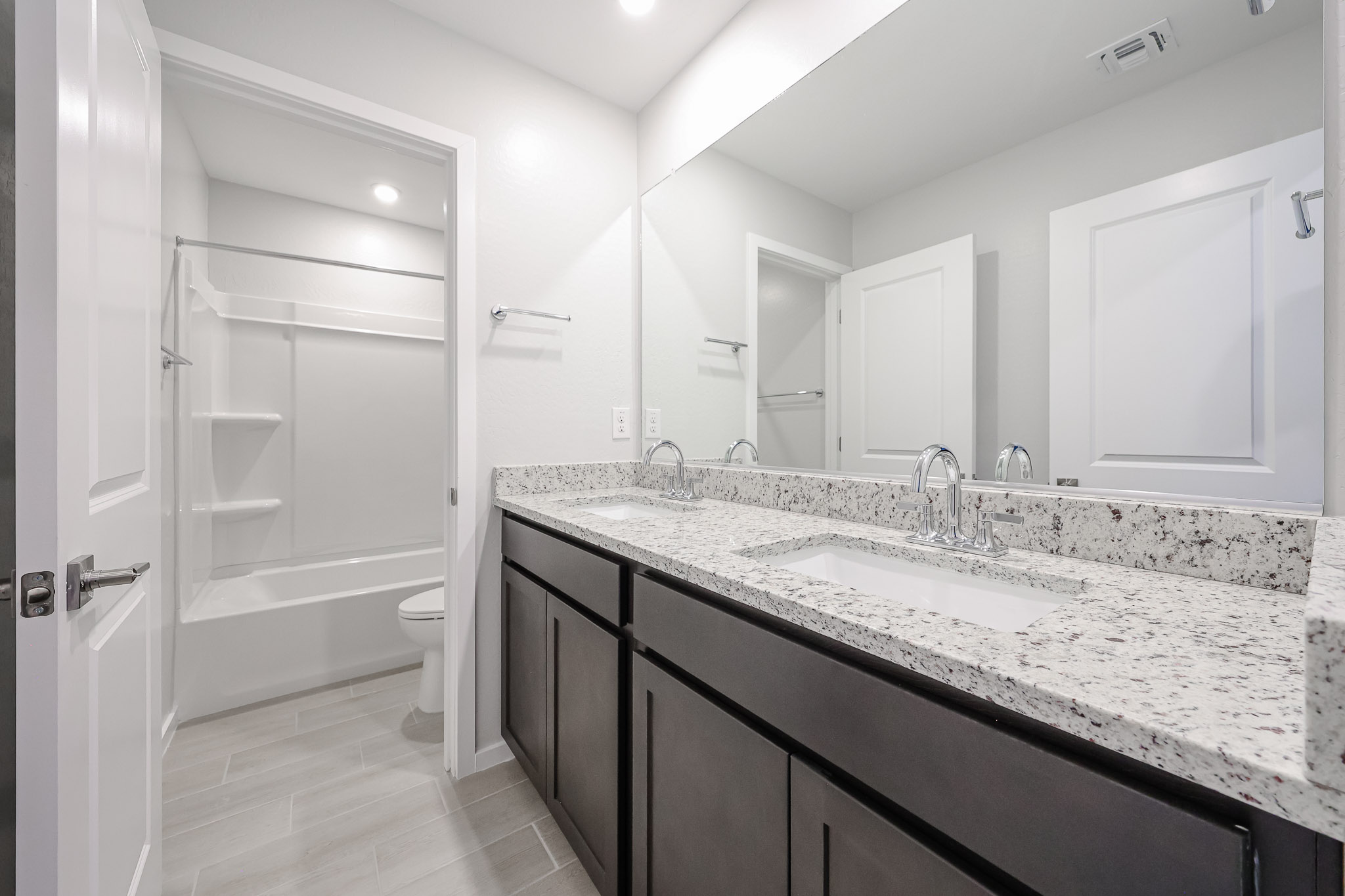 A bathroom with a marble countertop.