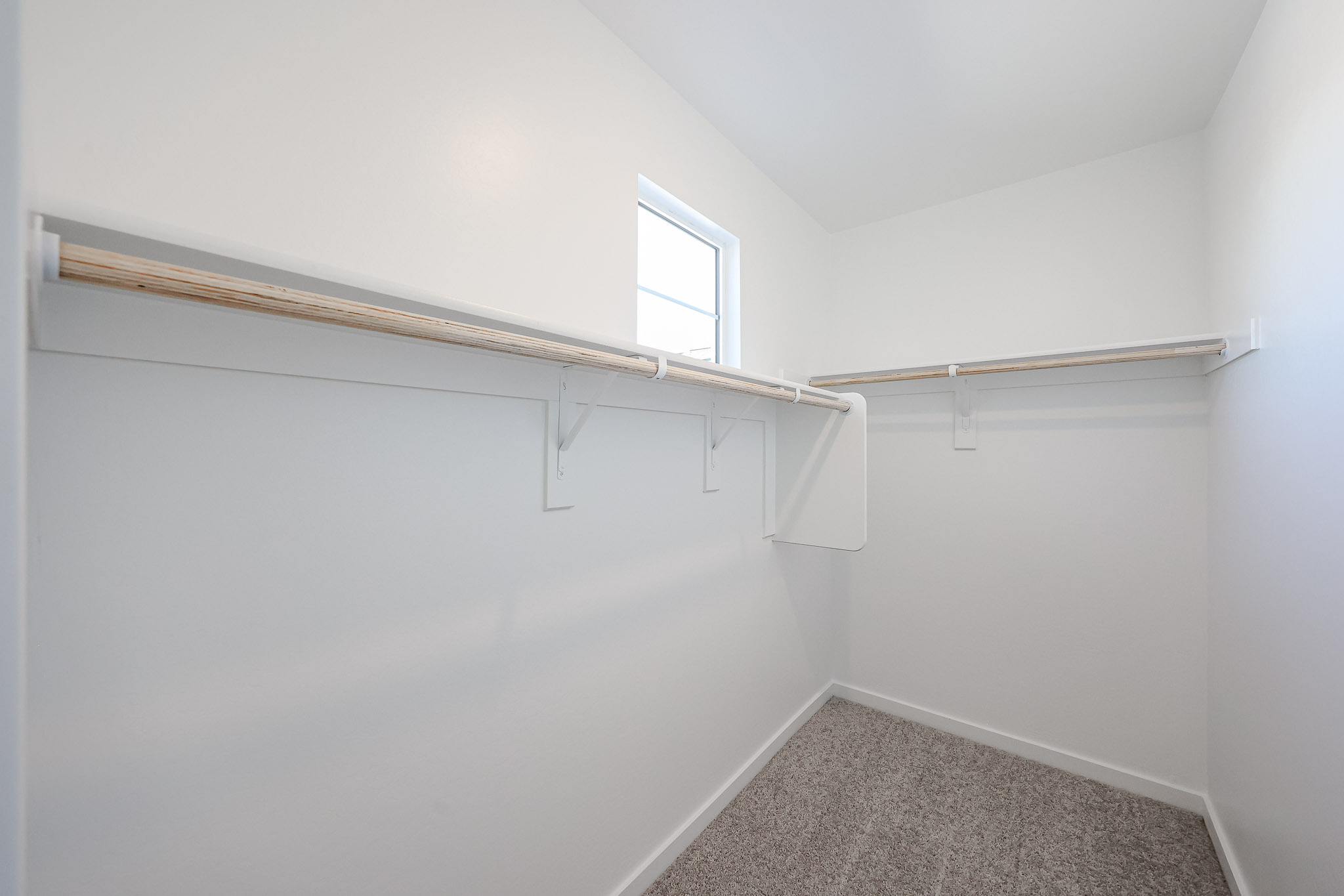 A white room with a window.