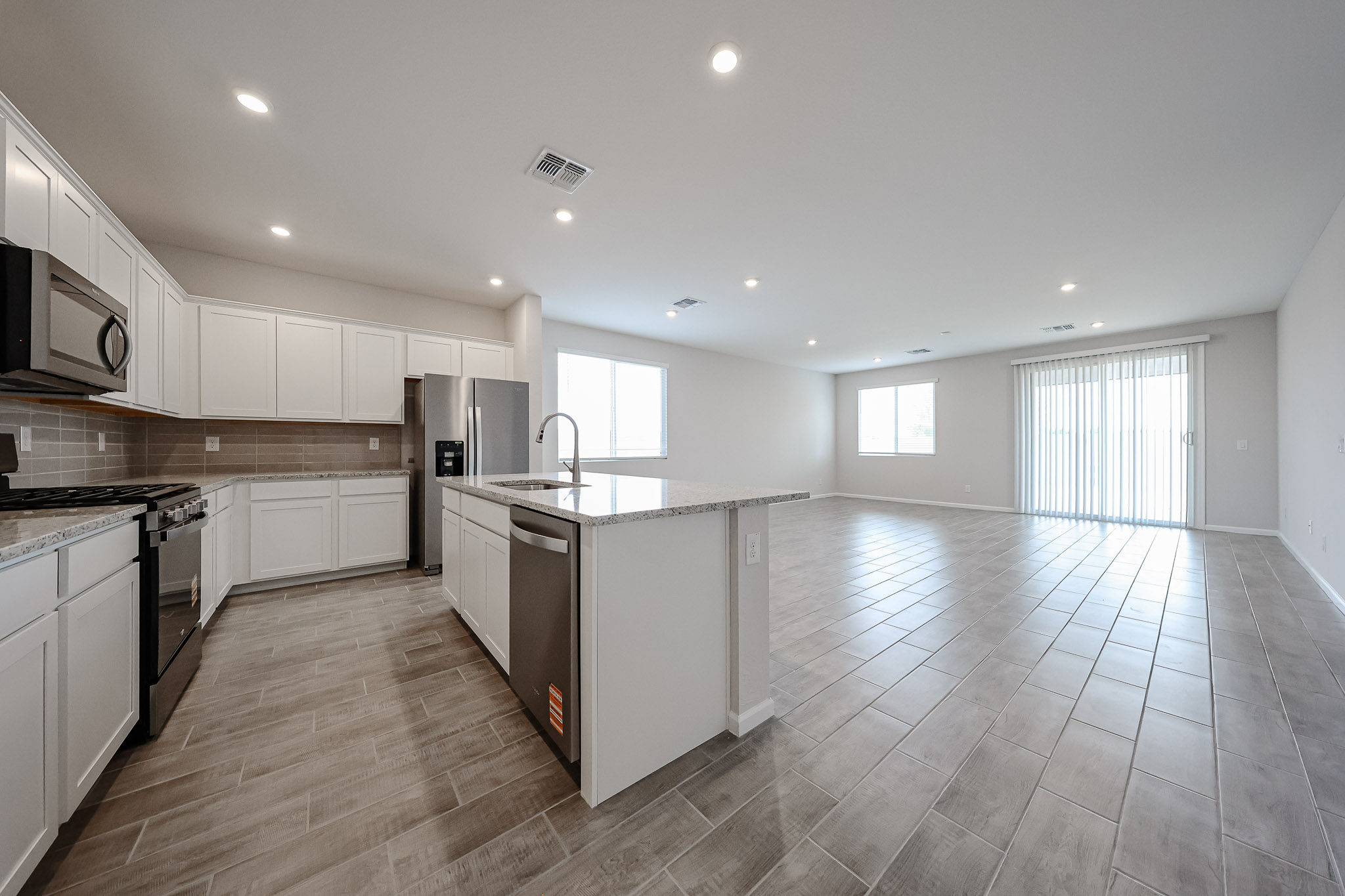 A kitchen with wooden floors.