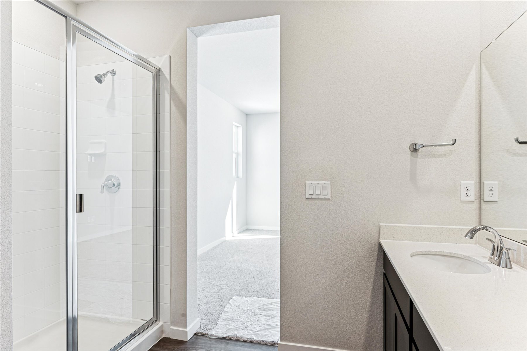 A bathroom with a glass shower.