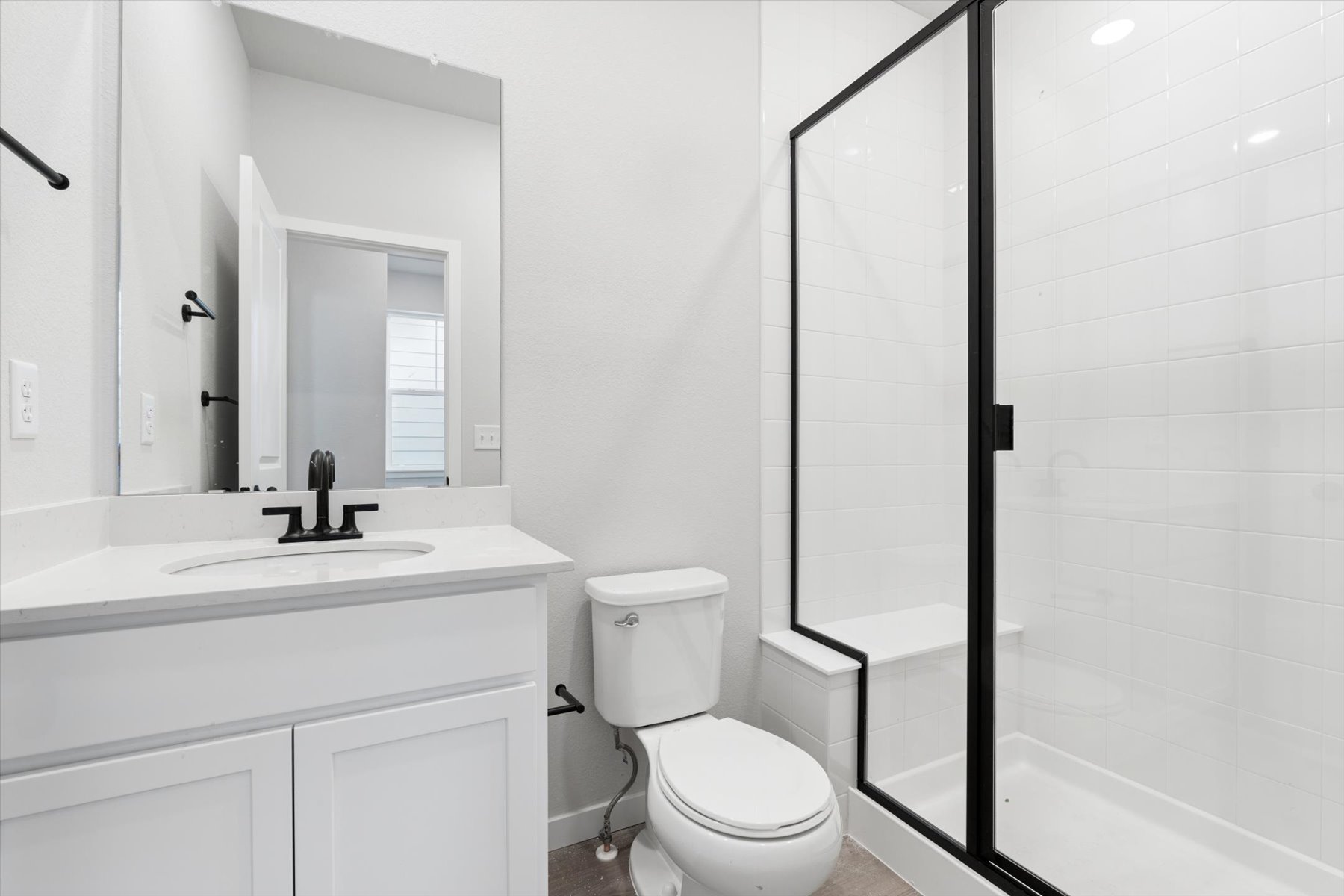 A bathroom with a glass shower.