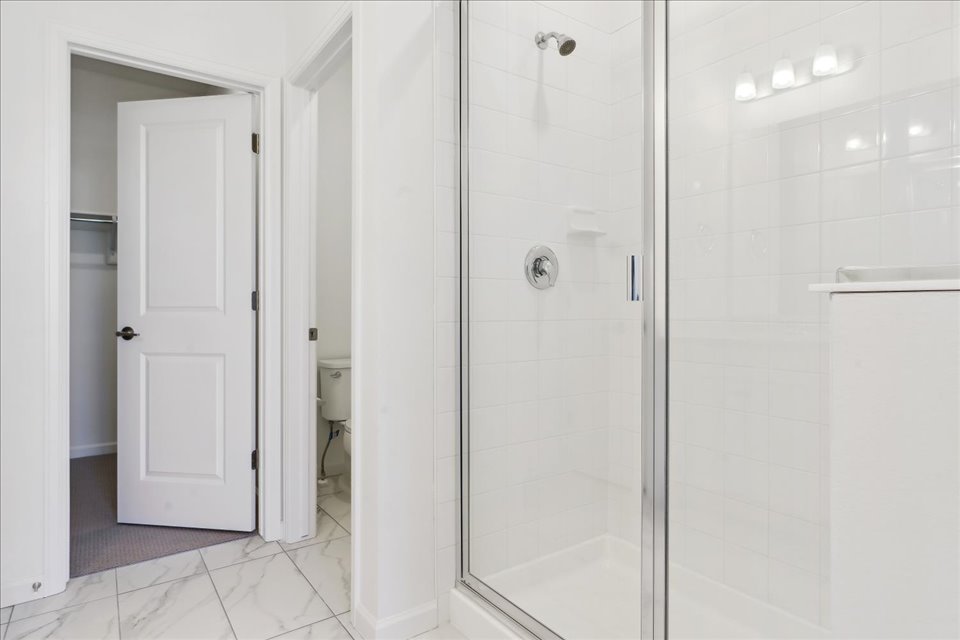 A bathroom with a glass shower.
