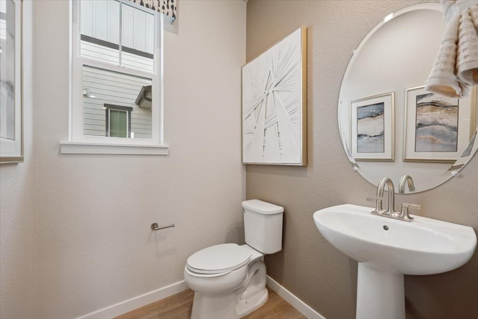 A bathroom with a toilet and sink.