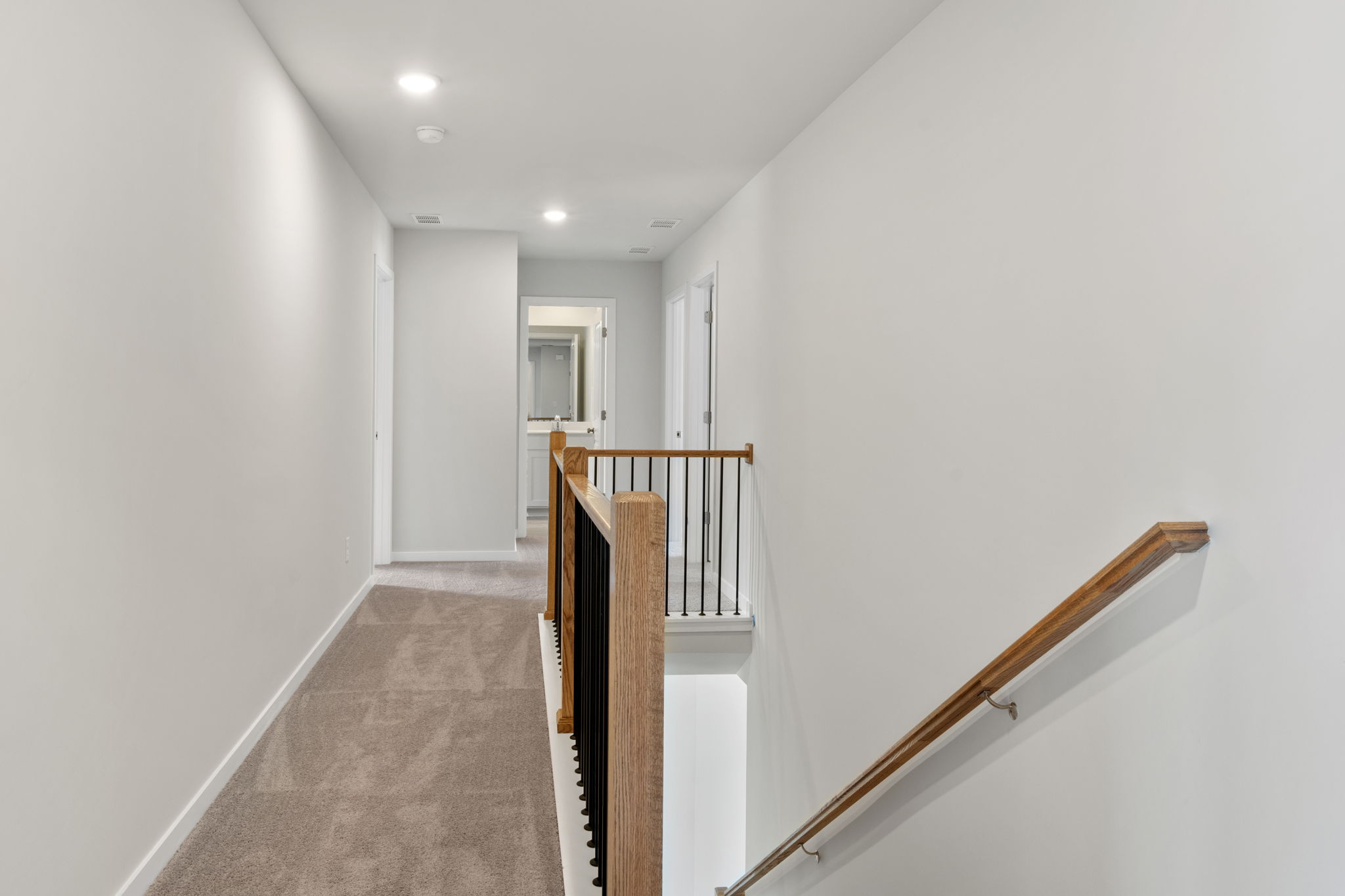 A hallway with white walls.