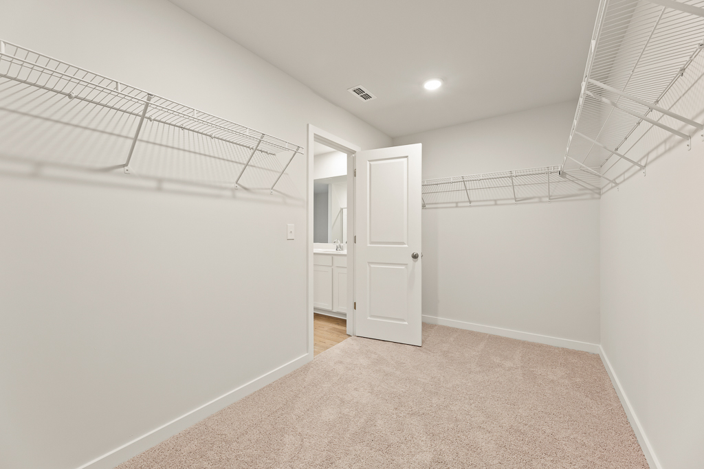 A hallway with white walls.
