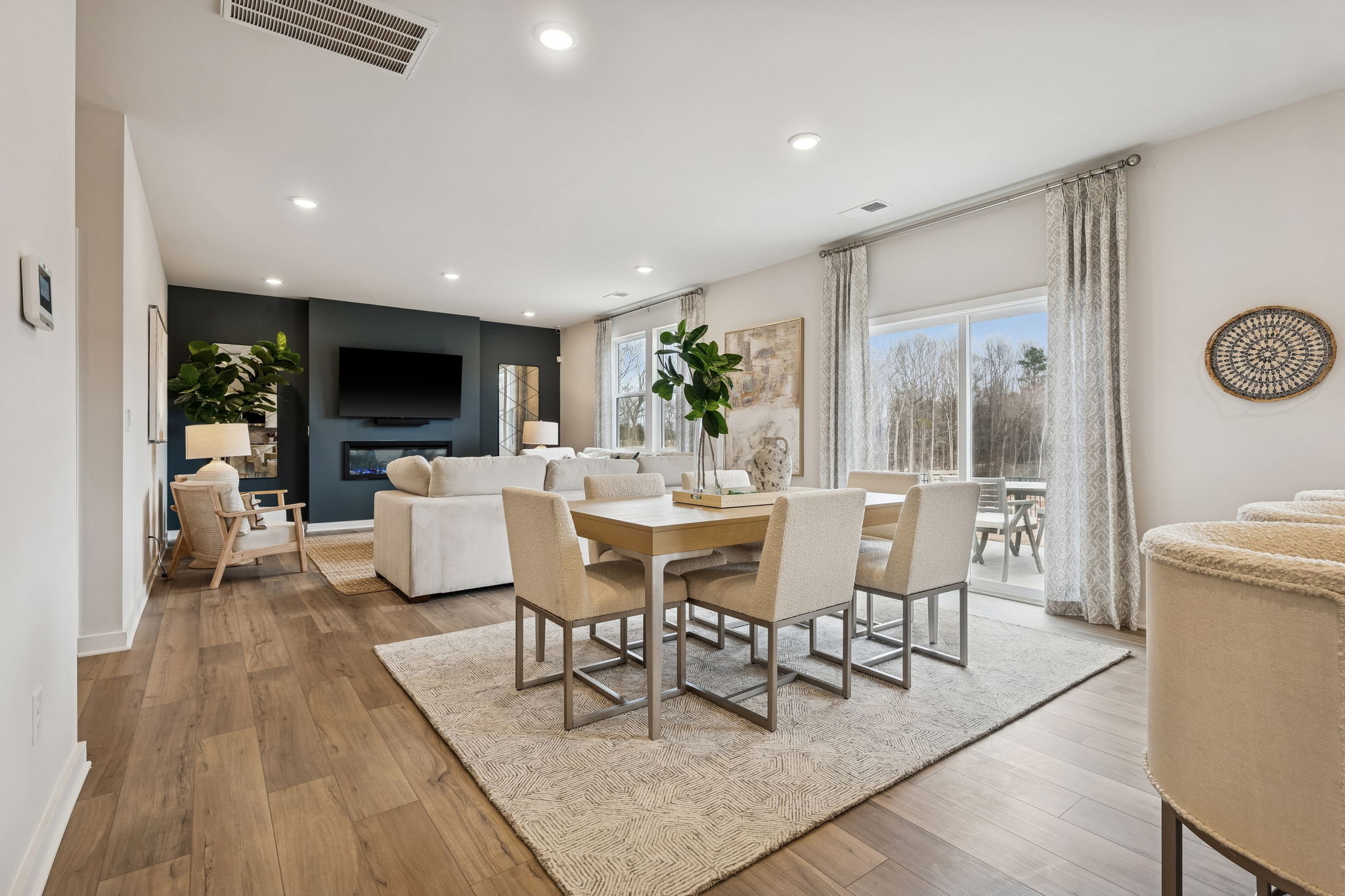 A dining room with a large window.