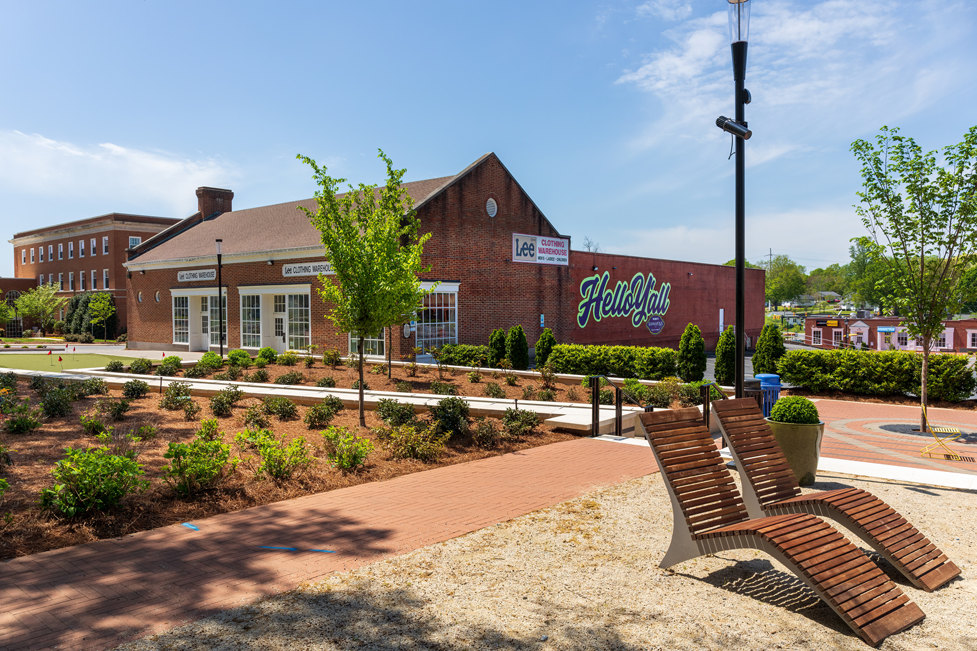 A brick building with a sign on it.