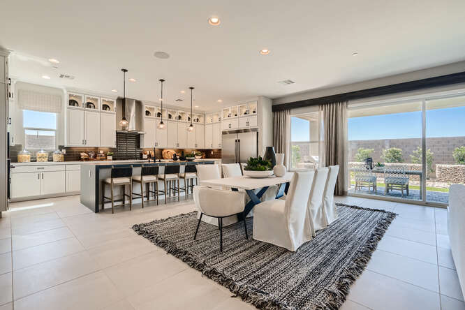 A large kitchen with a large dining area.