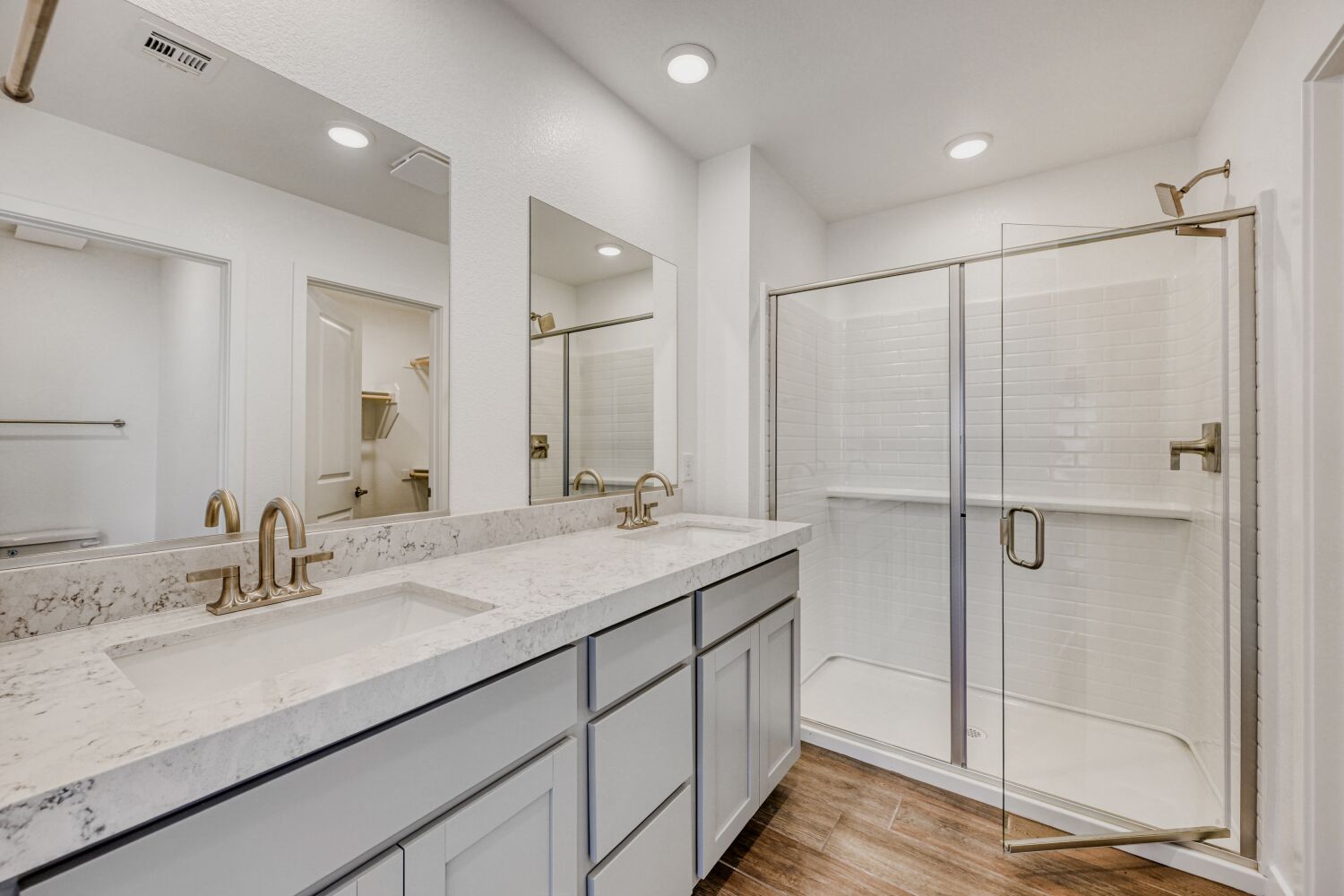 A bathroom with a glass shower.