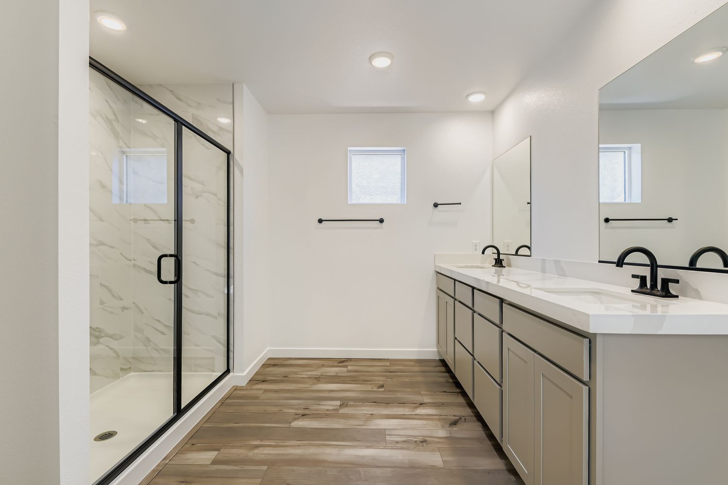 A bathroom with a glass shower.