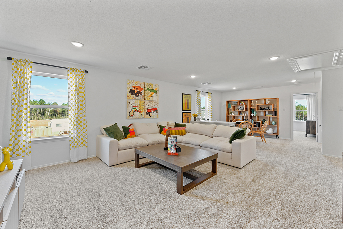A living room with a large window.