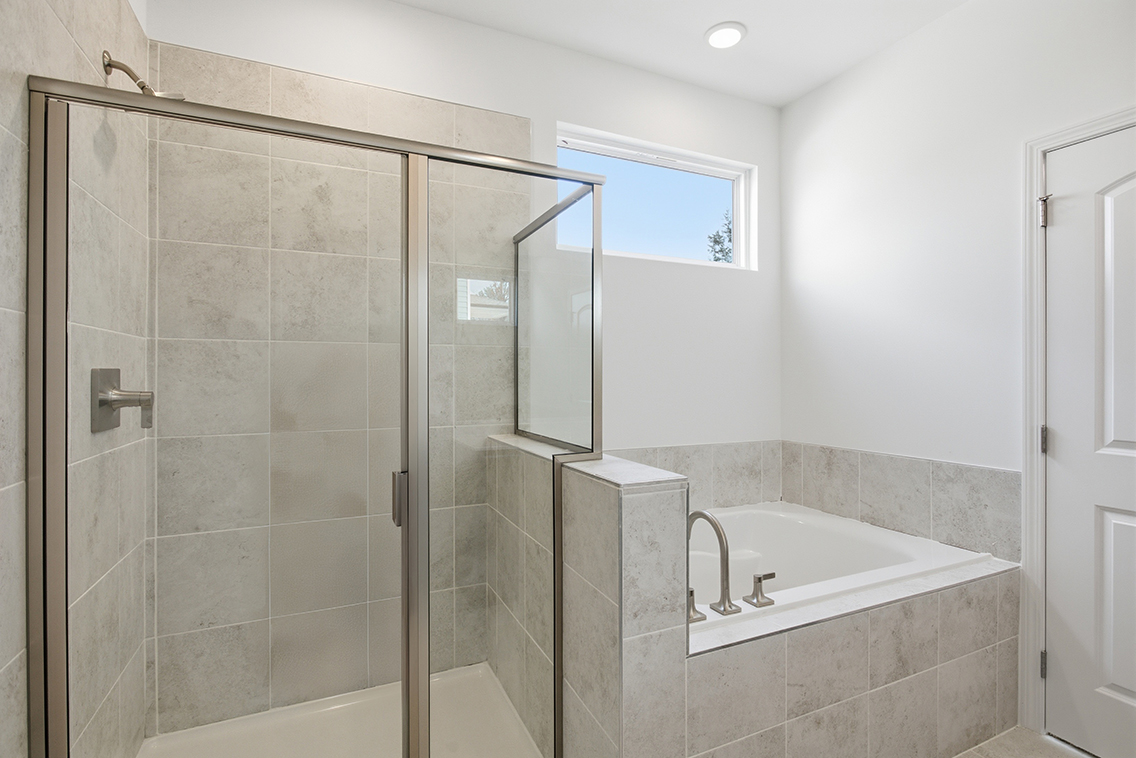 A bathroom with a glass shower.