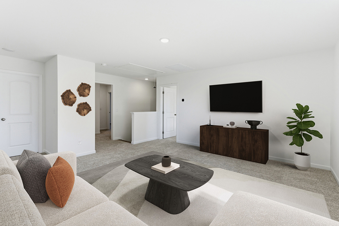A living room with a tv and a coffee table.