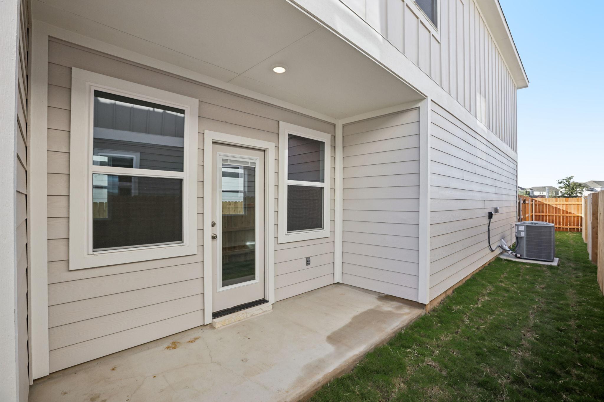 A white house with a small patio.
