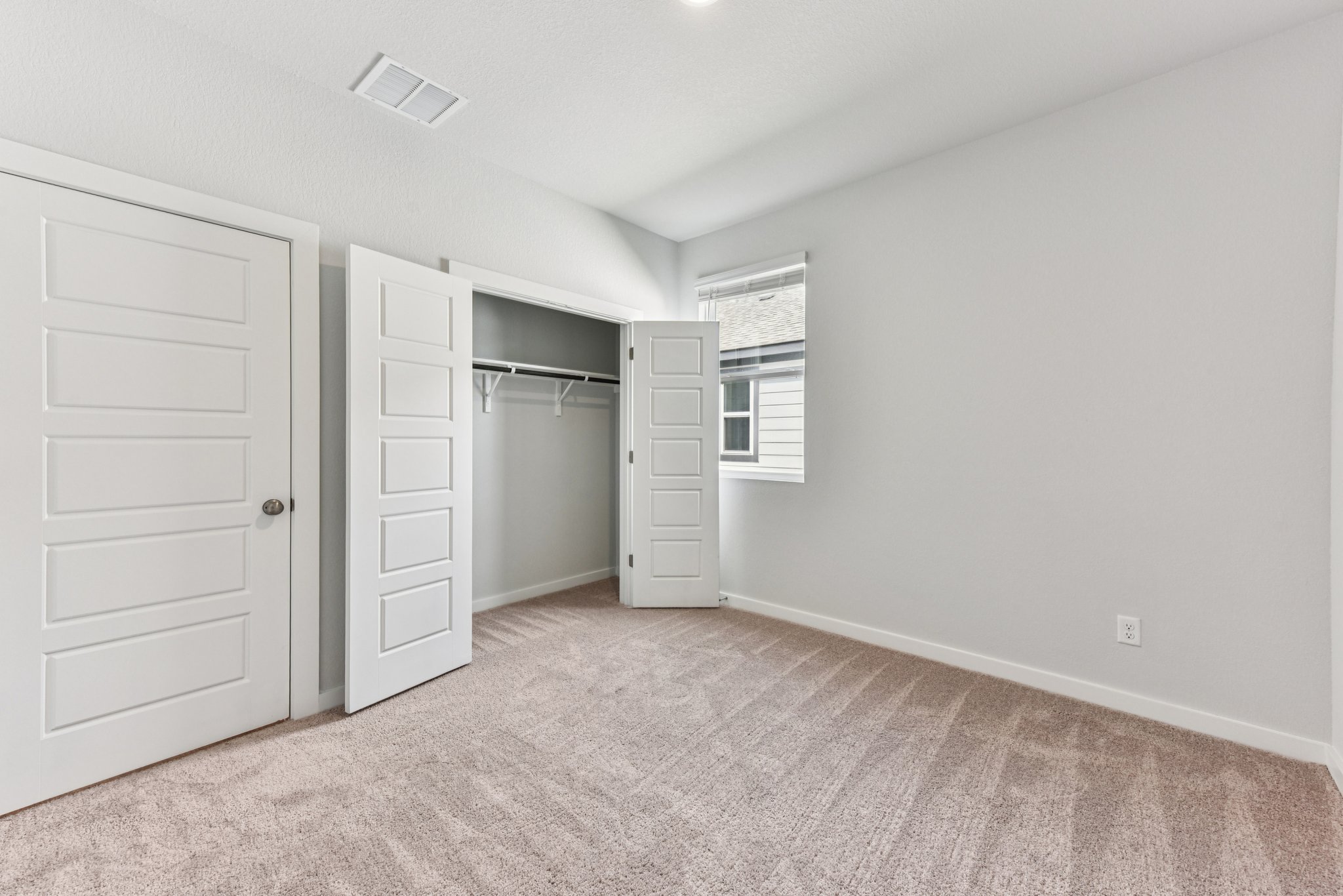 A room with white cabinets.