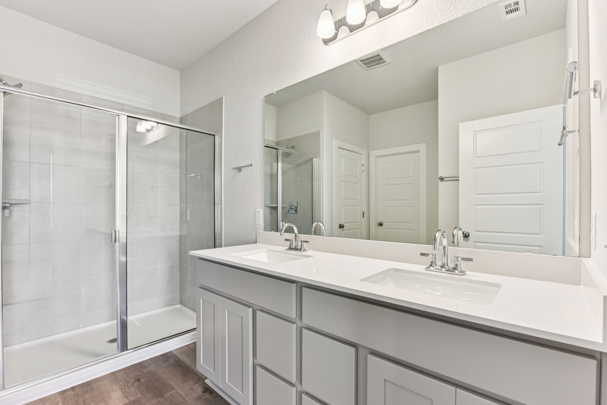 A bathroom with a glass shower.