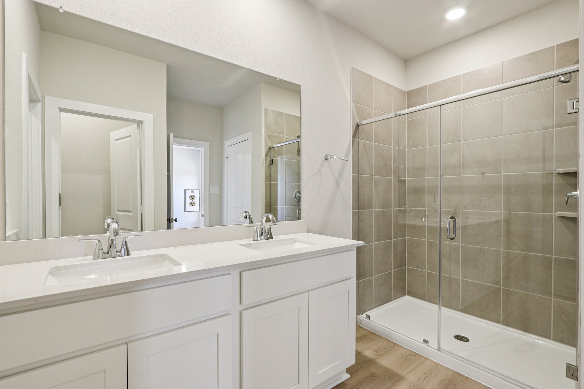 A bathroom with a glass shower.