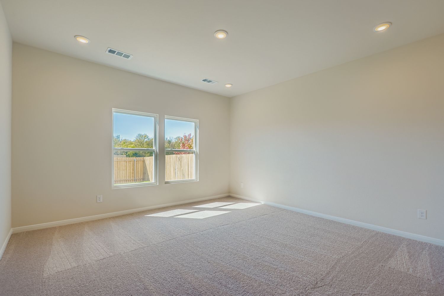 A room with a bed and a window.