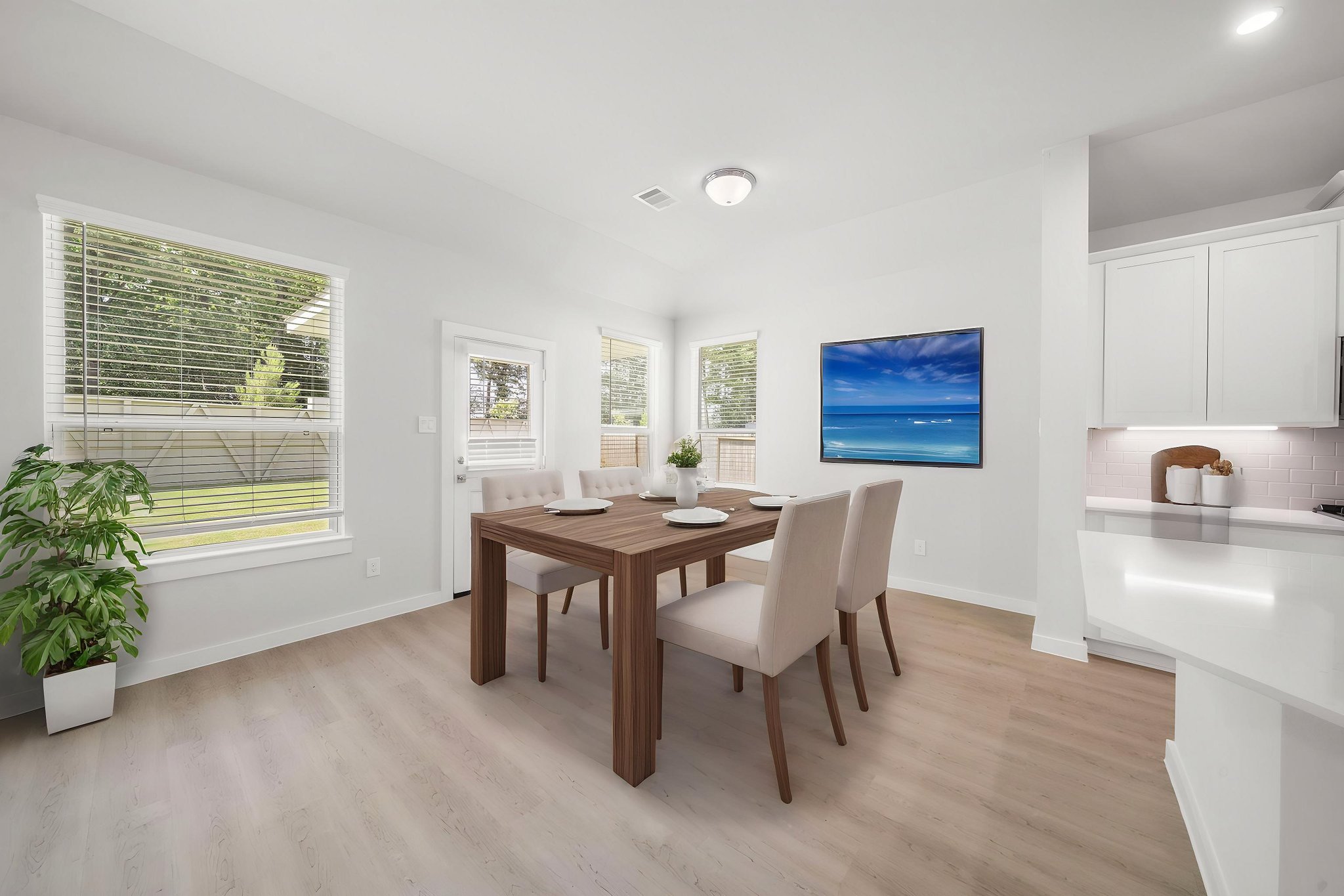 A room with a table and chairs.