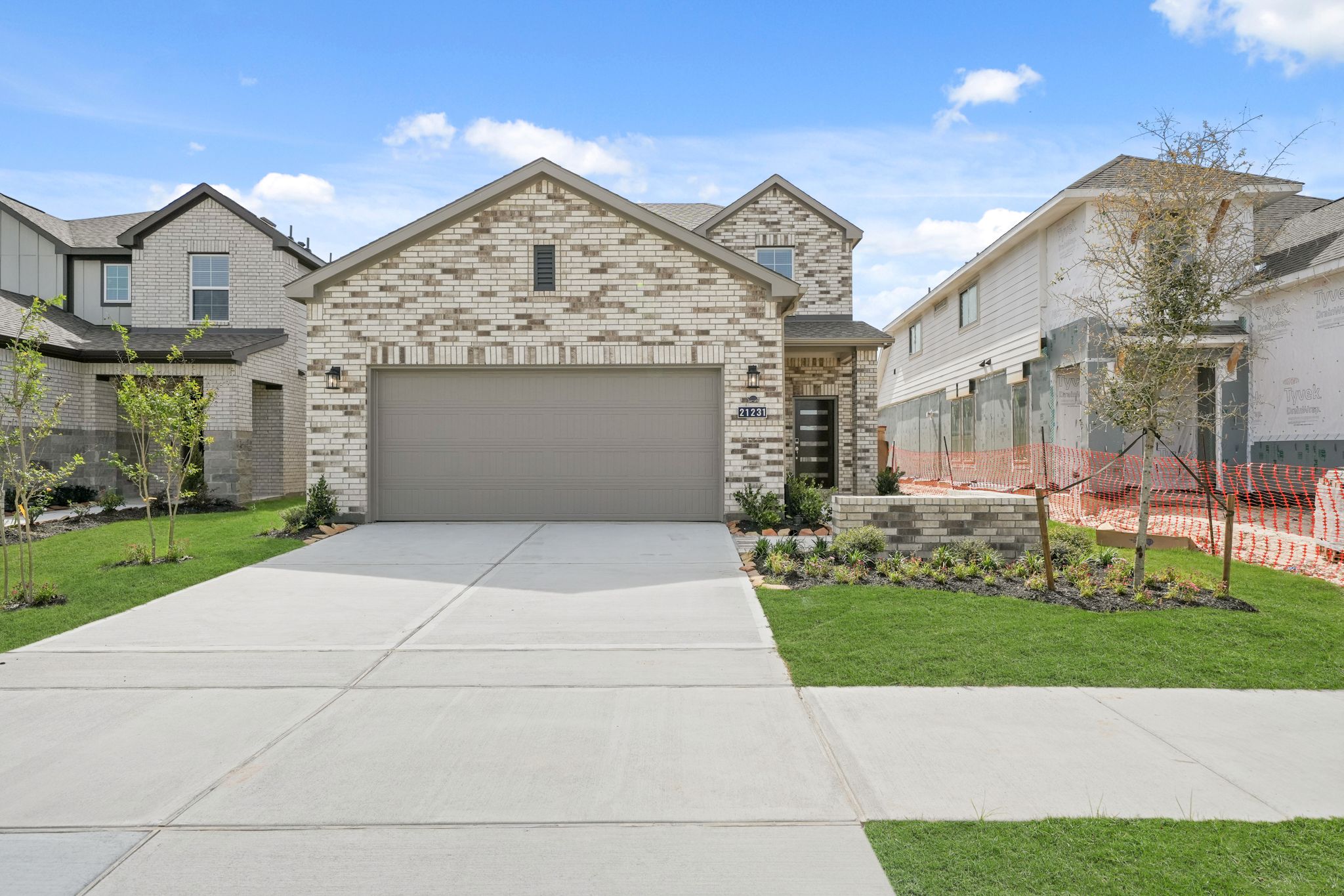 A driveway leading to a house.