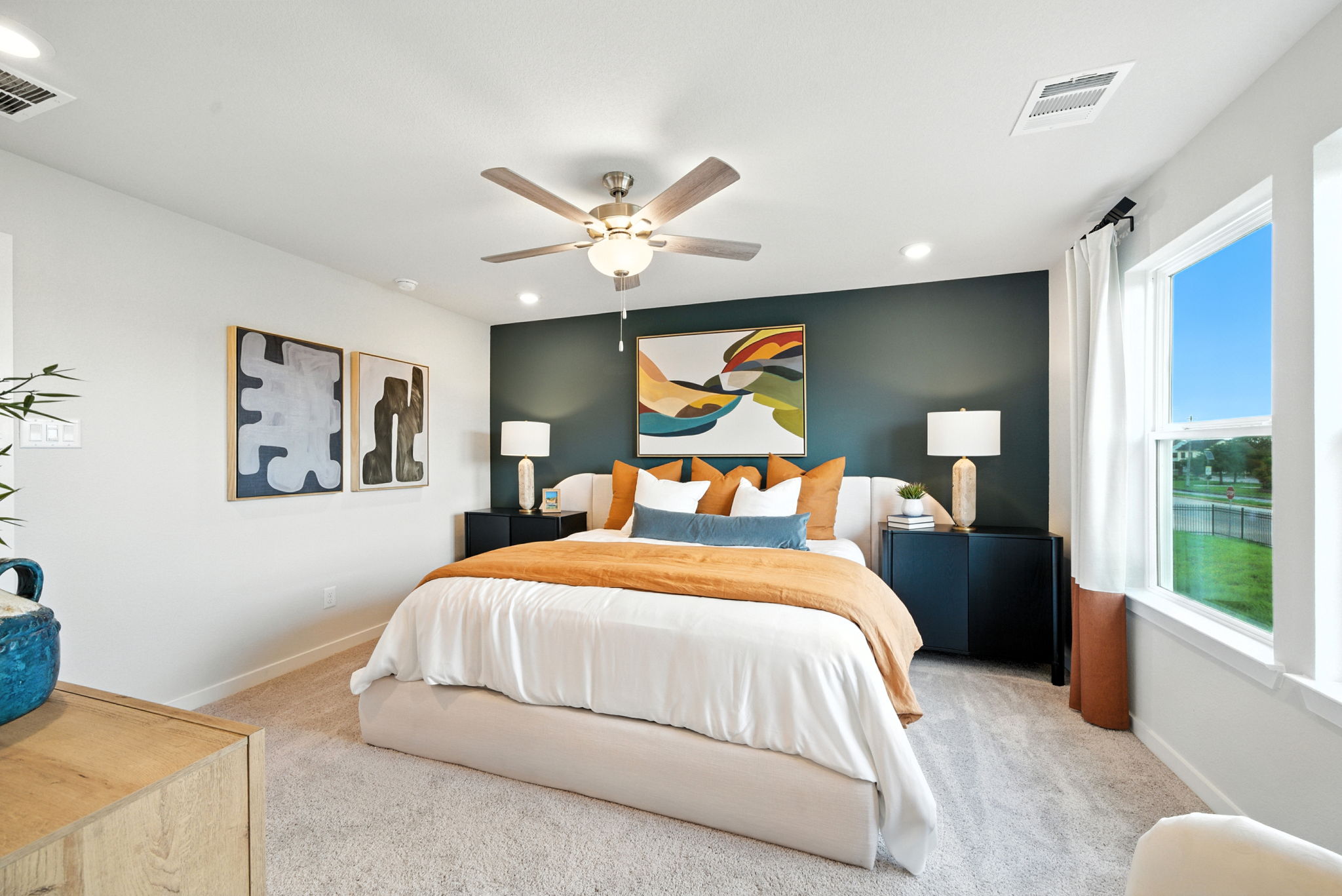 A bedroom with a large bed.