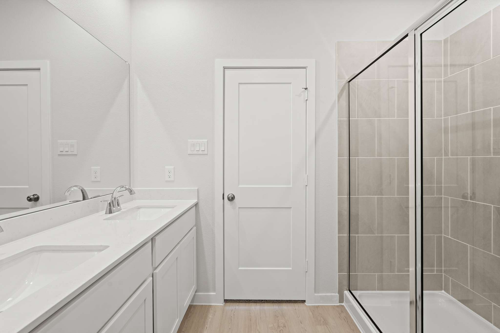 A bathroom with a glass shower.