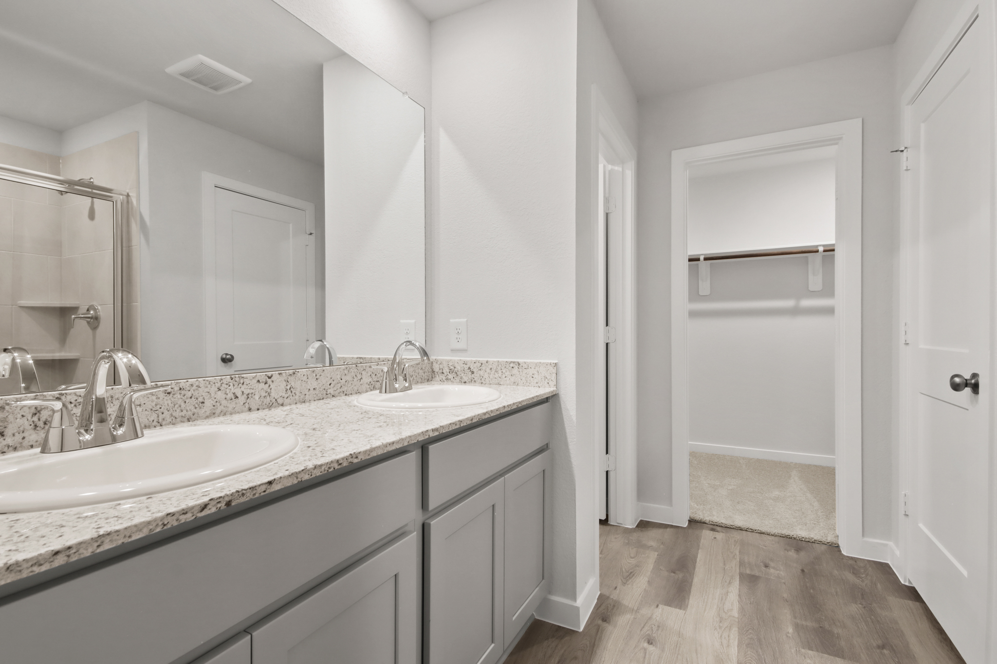 A bathroom with a marble countertop.
