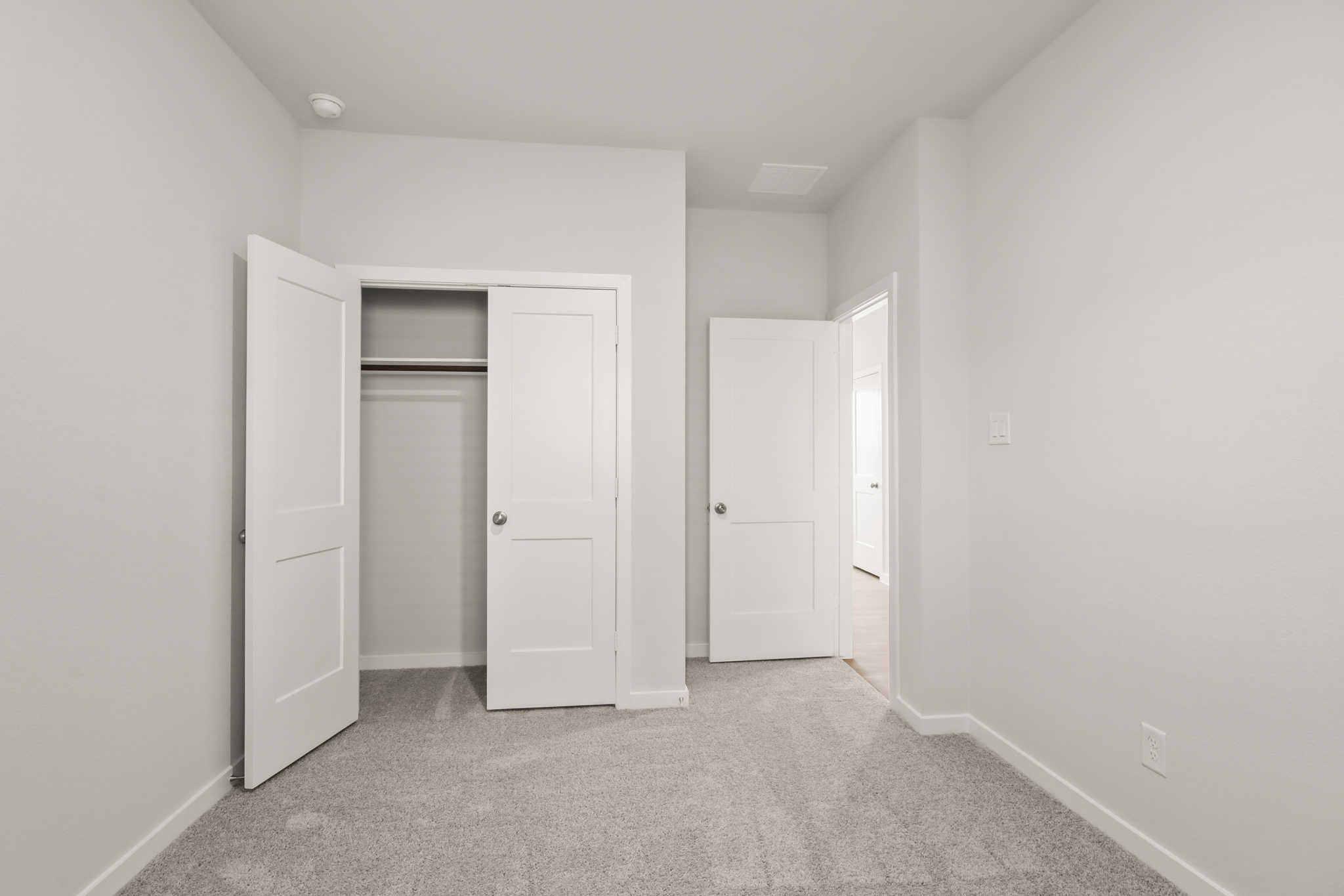 A room with white doors.