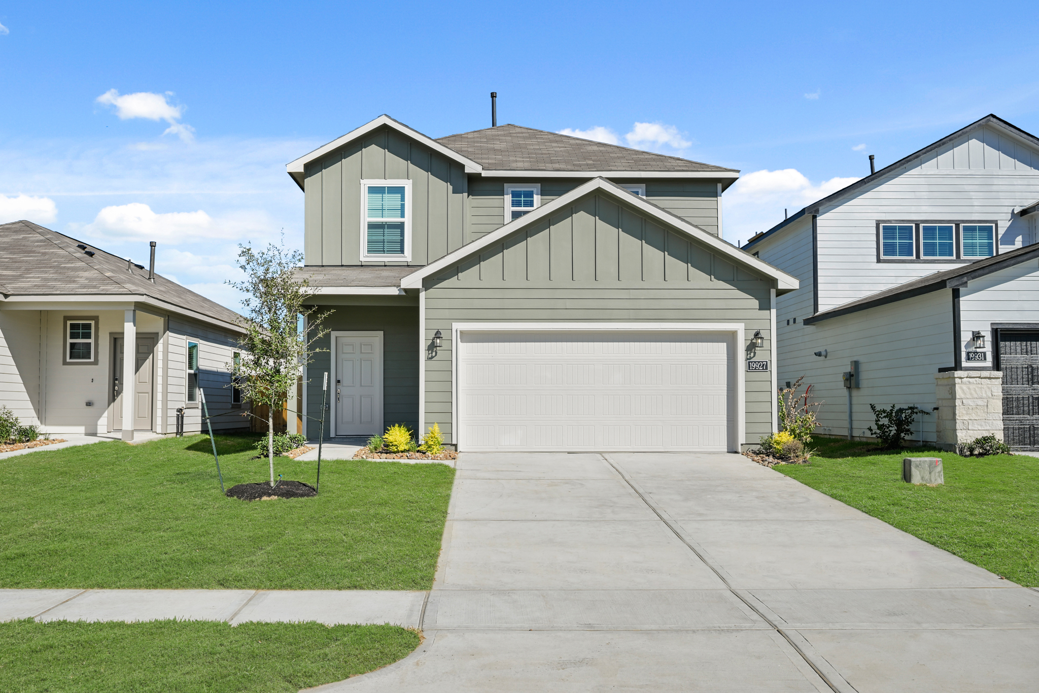 A driveway leading to a house.