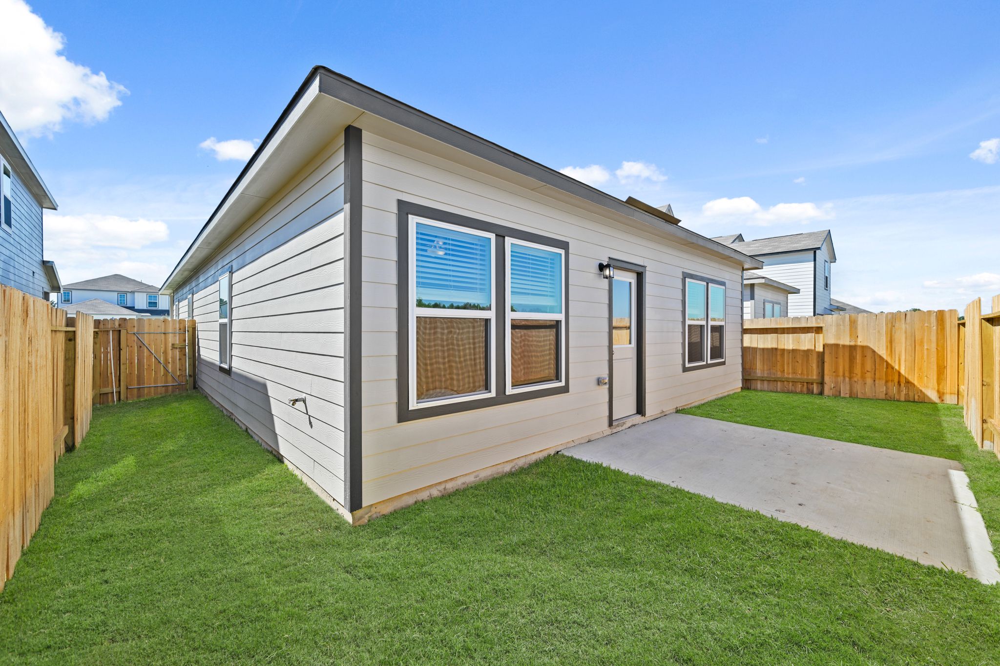 A house with a grass yard.