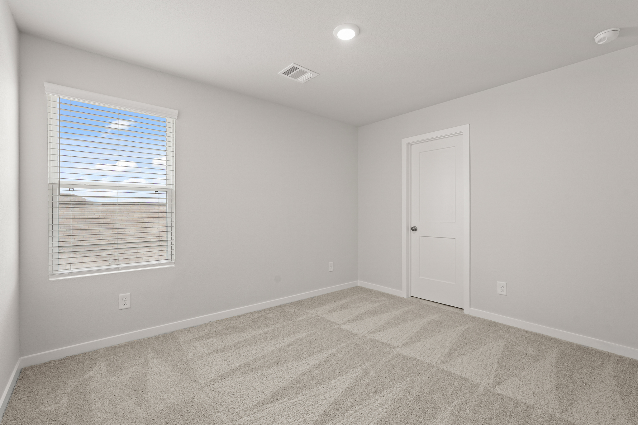 A room with a door and a window.