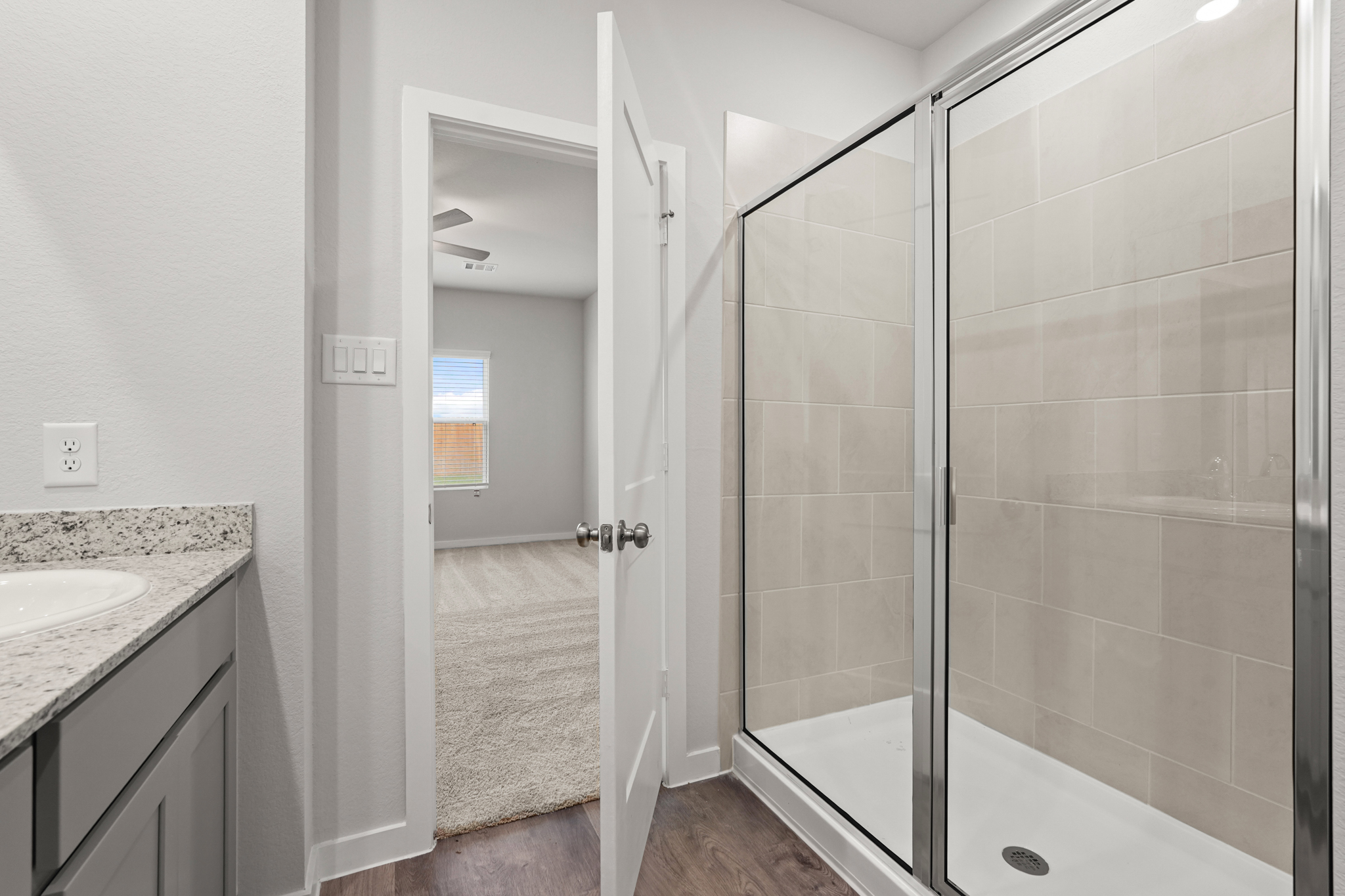 A bathroom with a glass shower.