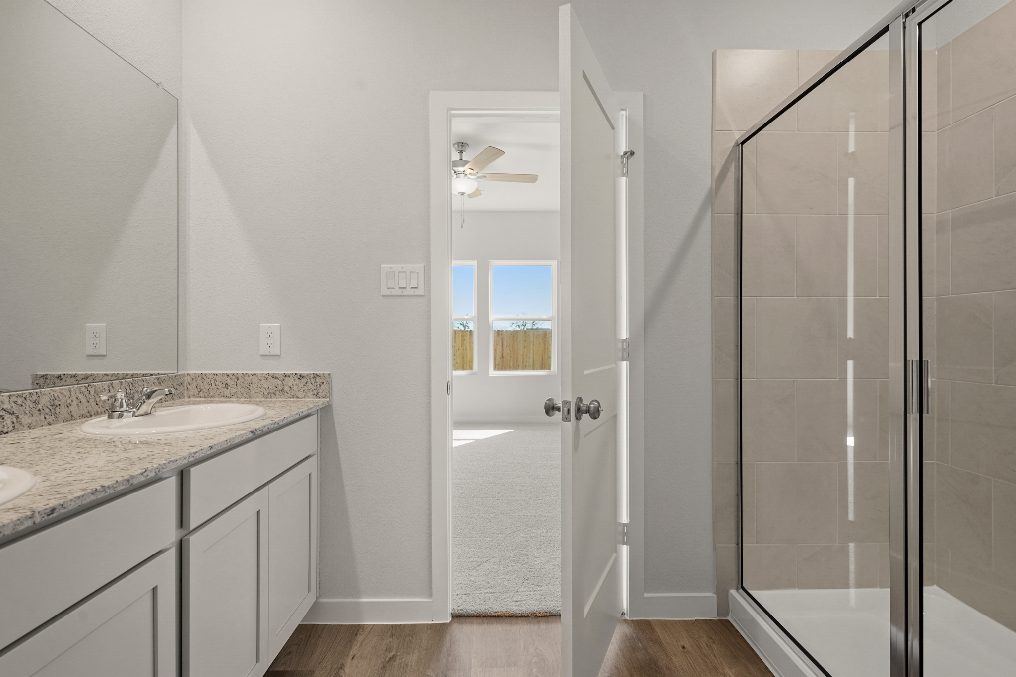 A bathroom with a glass shower.