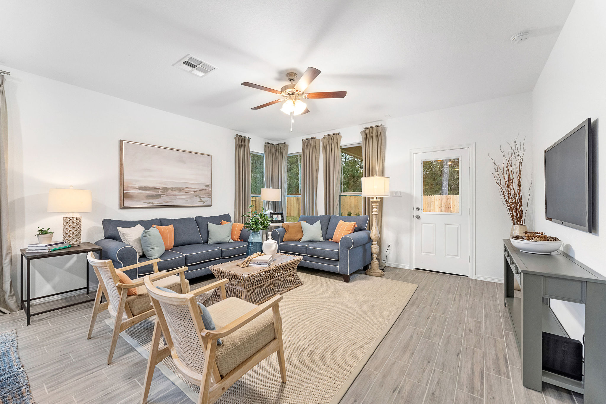 A living room with a wood floor.