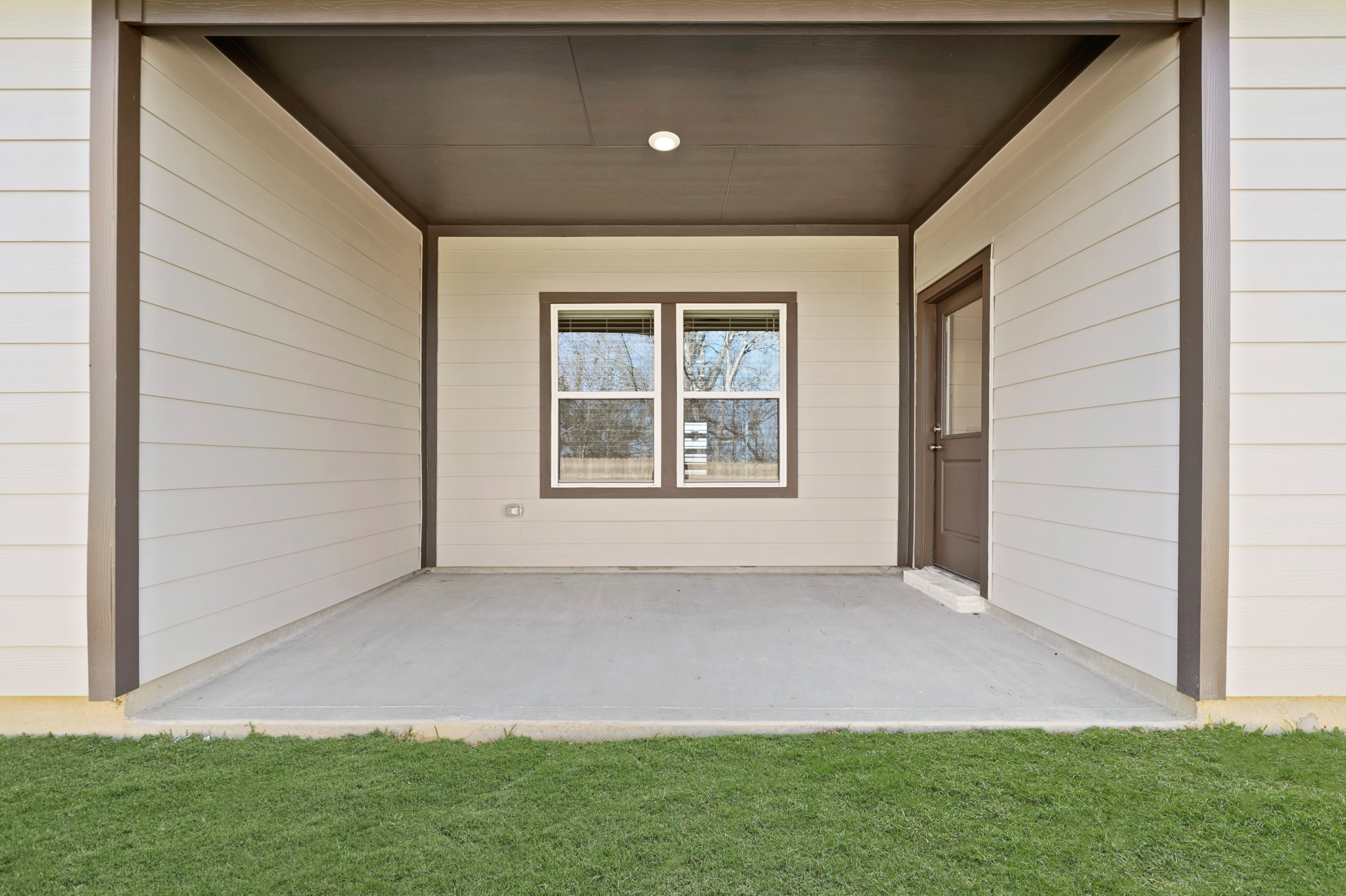 A house with a green lawn.
