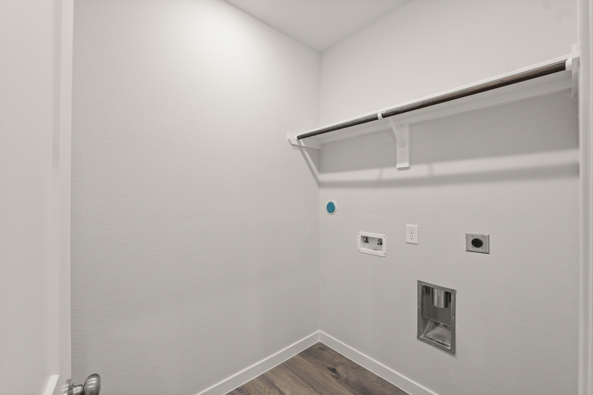 A white wall with a light on it.