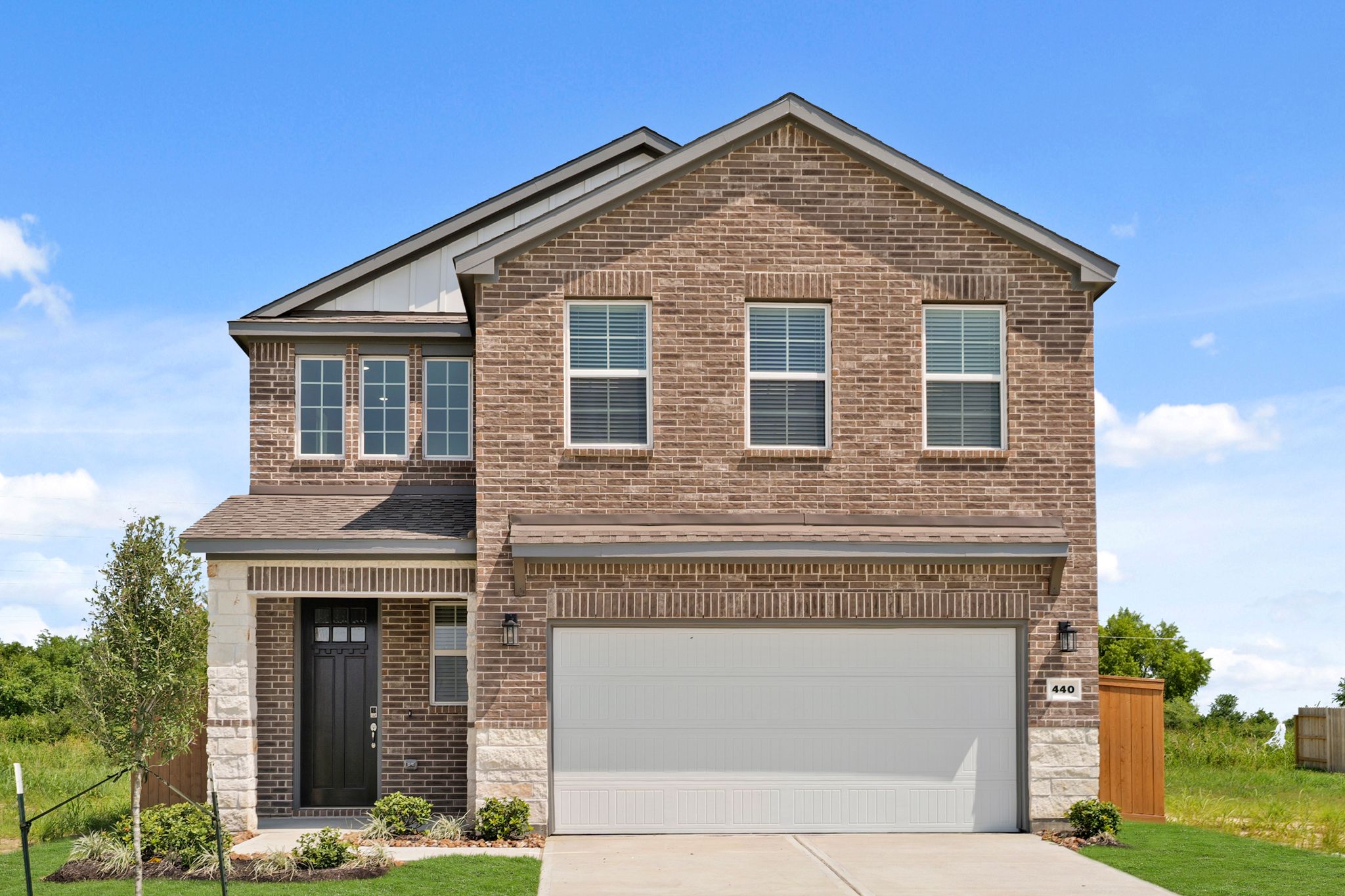 A brick building with a garage.