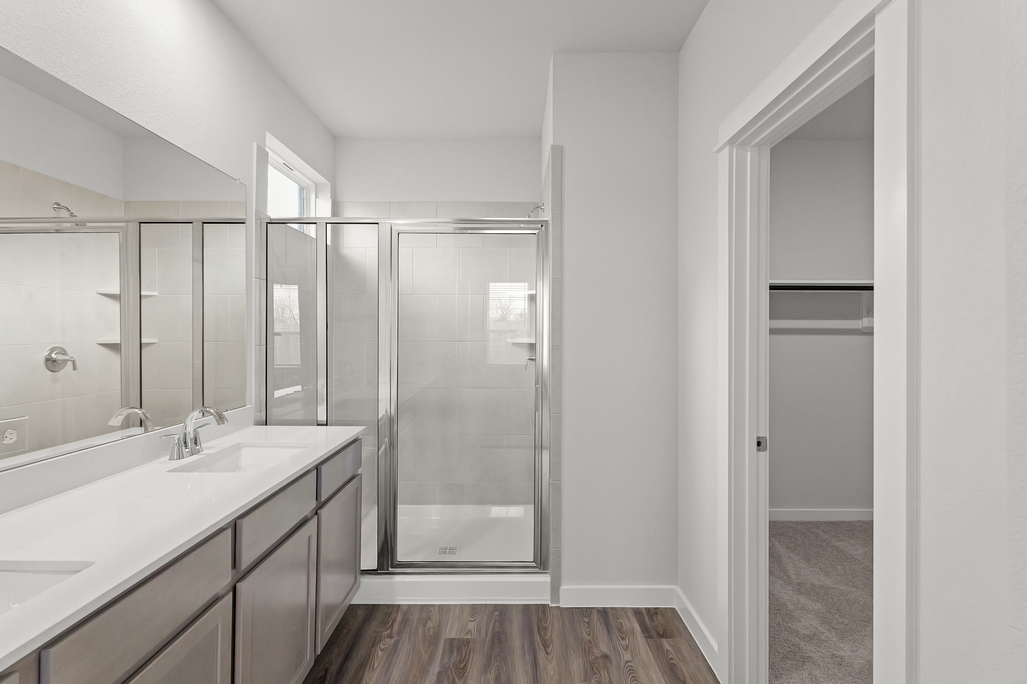 A bathroom with a glass shower.